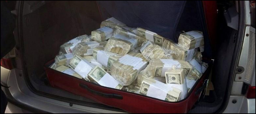 WATCH: People race to collect cash falling from armoured vehicle