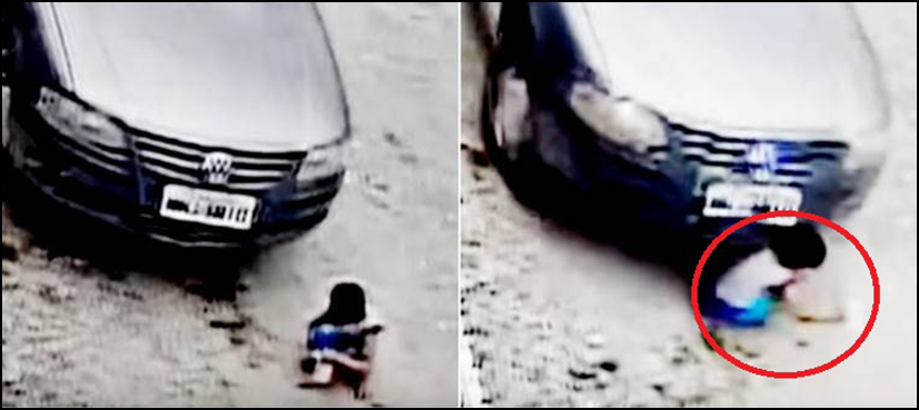 car runs over child