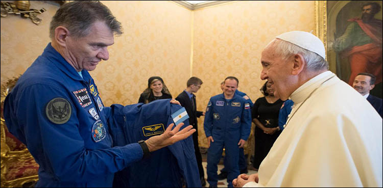 Astronauts give Pope Francis personalized space suit, add white cape