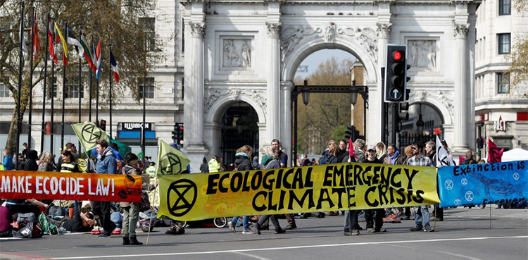 Climate change activists attend an Extinction Rebellion protest in London, Britain April 15, 2019. - REUTERS