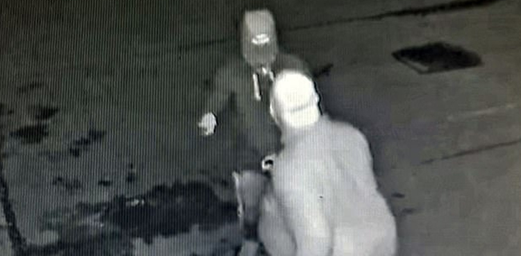 man throws watch armed mugger