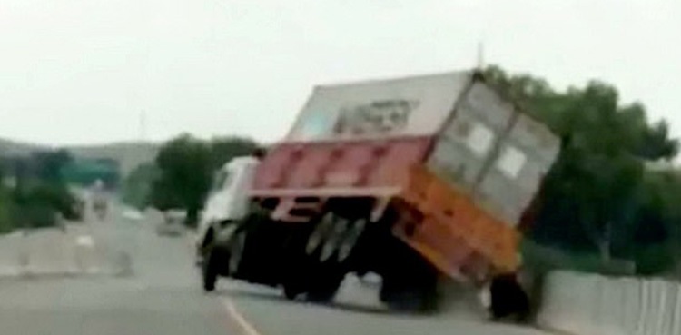 motorcyclists escape crash lorry