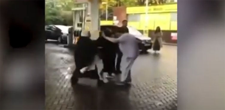 women, brawl, petrol station, face mask