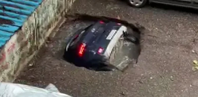 Sinkhole, swallows car rain
