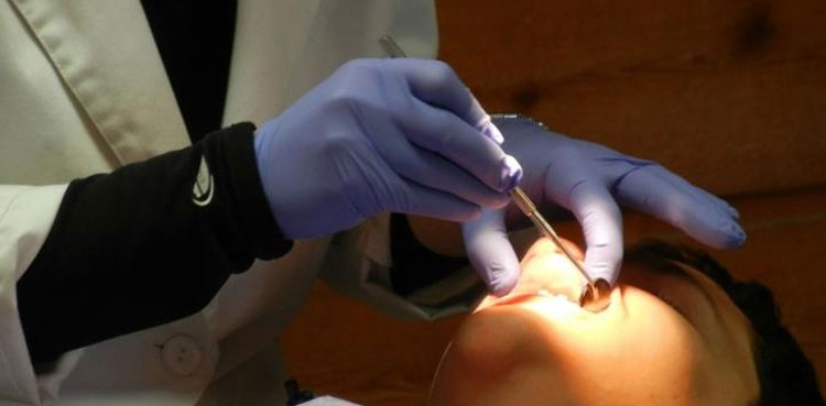 us woman dental clinic teeth clueless patient