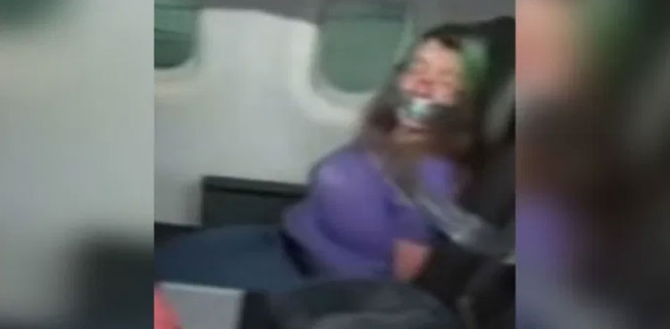 woman-duct-taped-plane-mid-air-door
