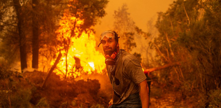 Firefighters try to contain wildfire destruction on Greek island