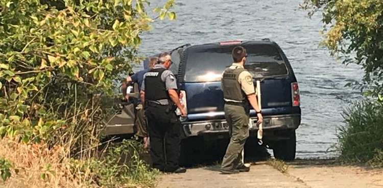 man submerge car river radiator