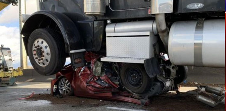 Car folded in half crash turck