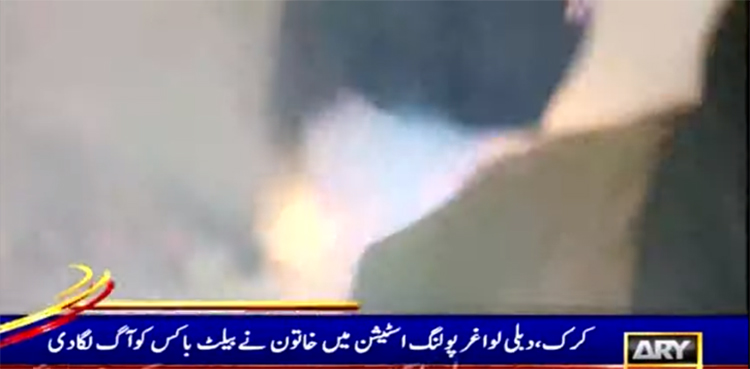 kp lg polls woman fire ballot box
