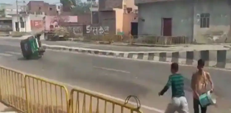 Auto overturns water balloon