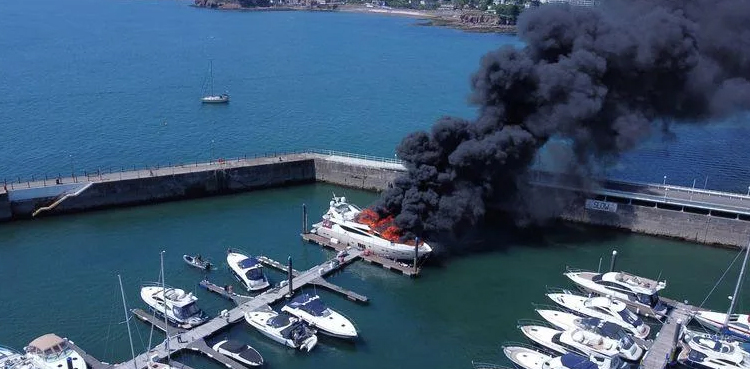 Fire engulfs superyacht in British marina