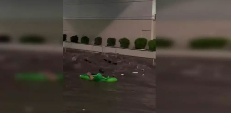 man-swims-flooded-roads-las-vegas