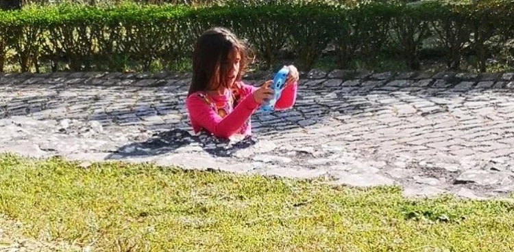 optical illusion girl sunk in concrete