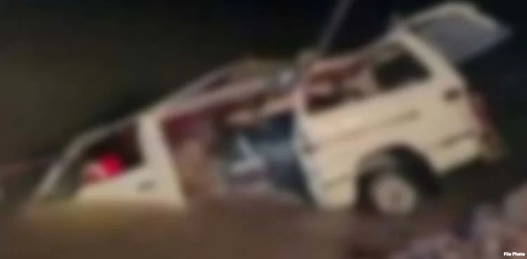 van overturns, flood water, Larkana