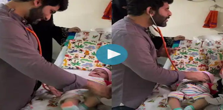 Dr Sayed Mujahid Husain, Doctor, vaccinates baby