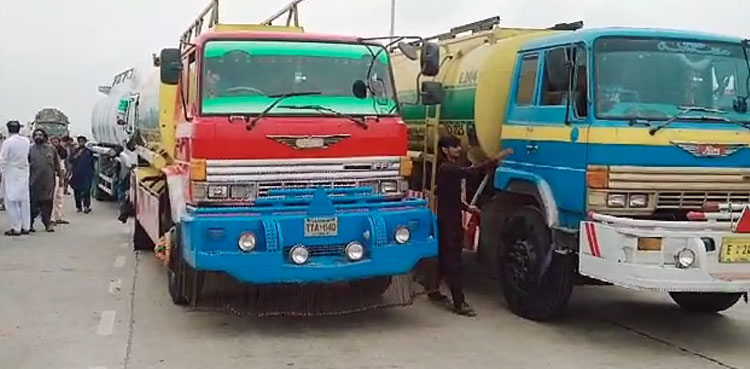 Transporters protest, vehicles burning, Karachi