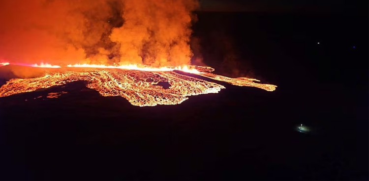 Volcano erupts, Iceland, flowing lava,