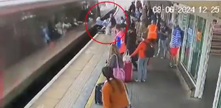 Baby, narrowly escapes, disaster, pram clips, moving train