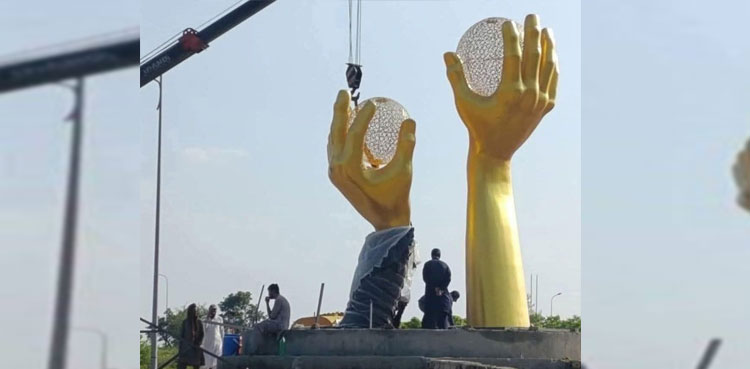 golden hands sculpture, Islamabad, CDA