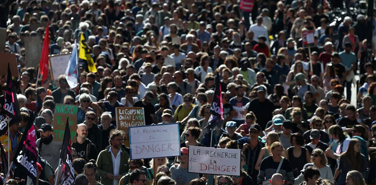 French unions strike against austerity, pressuring Macron