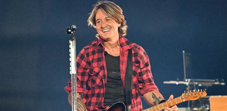 Keith Urban lights up stage with Nicole Kidman photo during first show after split