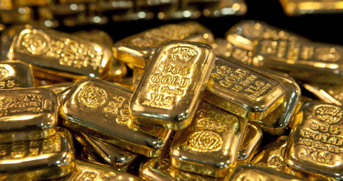 Gold dips on stronger dollar, US-China trade deal hopes